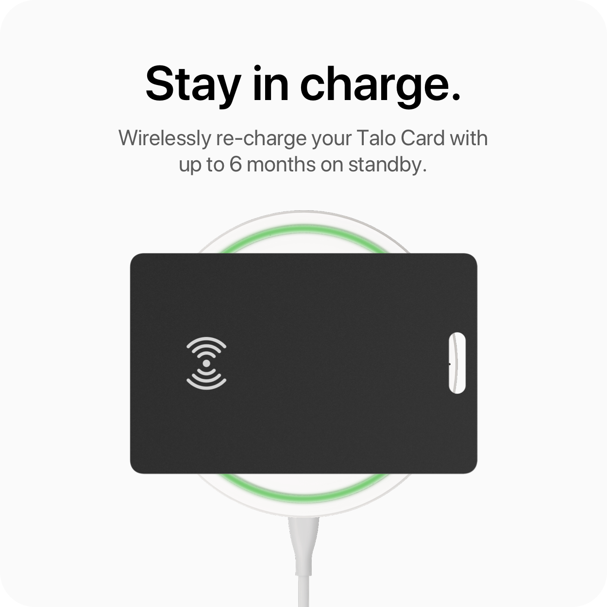 Talo Card wirelessly charging on a pad, showing glowing charge indicator.